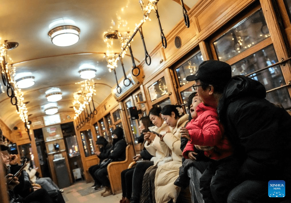 Trams decorated with lights to attract tourists in Dalian, China's Liaoning-9