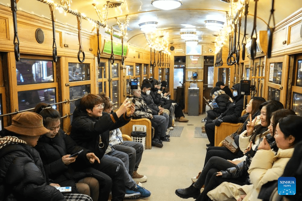 Trams decorated with lights to attract tourists in Dalian, China's Liaoning-8