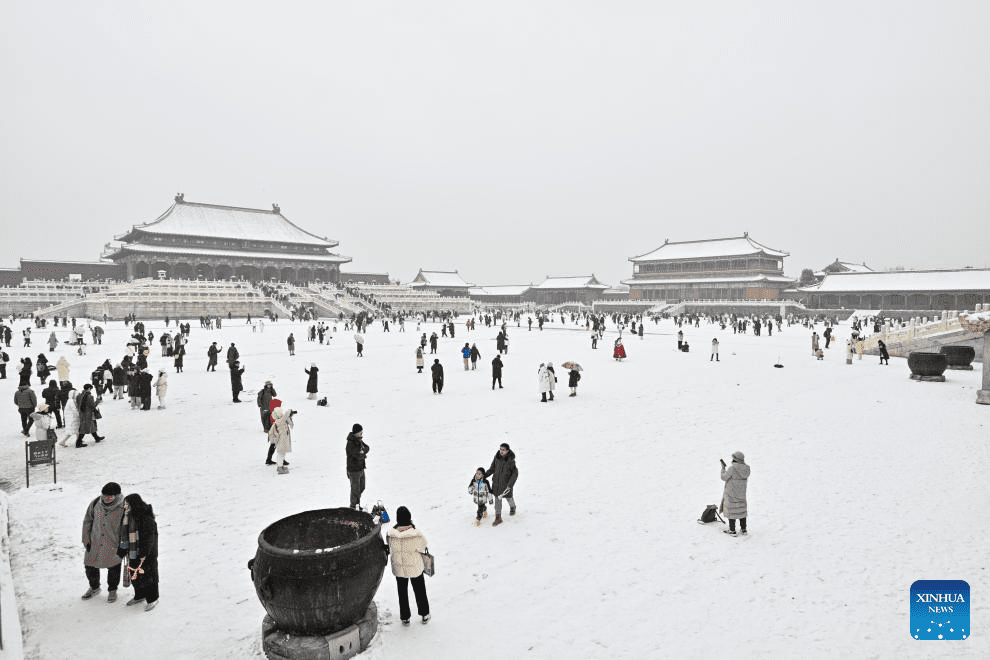 Tourists visit Palace Museum in snow in Beijing-26