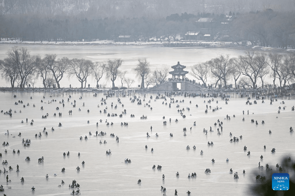 Tourists have fun on frozen lake at Summer Palace in Beijing-1