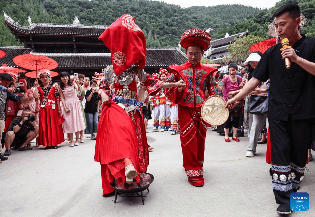 Local authorities in SW China leverage ethnic features to boost summer tourism-2