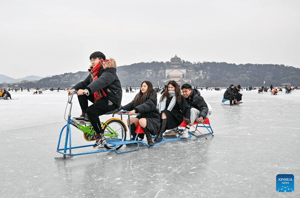 Tourists have fun on frozen lake at Summer Palace in Beijing-3