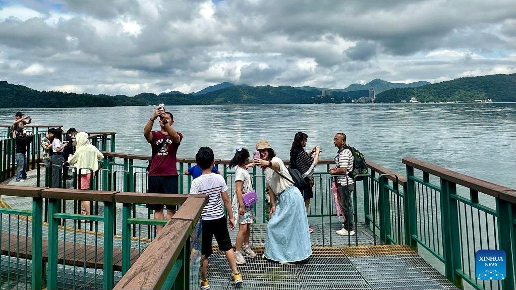 Tourists visit Riyue Tan scenic spot during holiday of Dragon Boat Festival-2