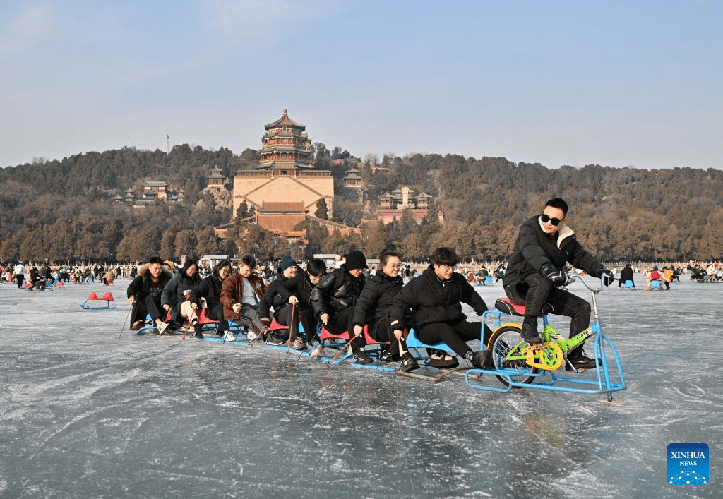 Tourists have fun on frozen lake at Summer Palace in Beijing-4