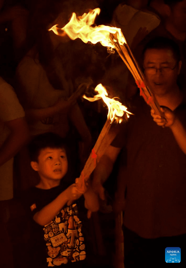 Torch festival celebrated in Chuxiong, SW China-5