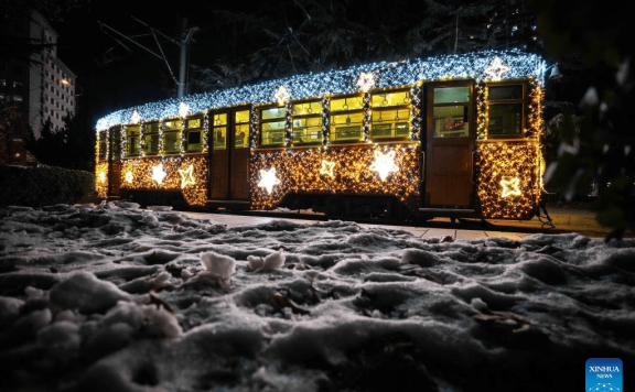 Trams decorated with lights to attract tourists in Dalian, China’s Liaoning