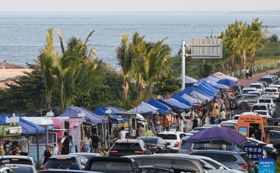 Scenic coastal highway attracts tourists for self-driving tour during holiday in Hainan