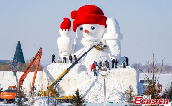 Landmark snowman under construction in NE China