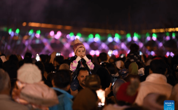 People watch firework show in Tehran, Iran