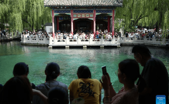 People visit Baotu Spring in Jinan, E China